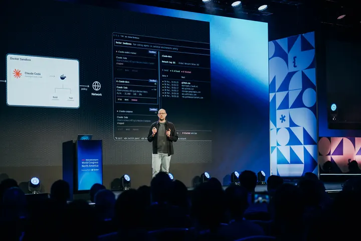 Speaker presenting on a World Congress stage.